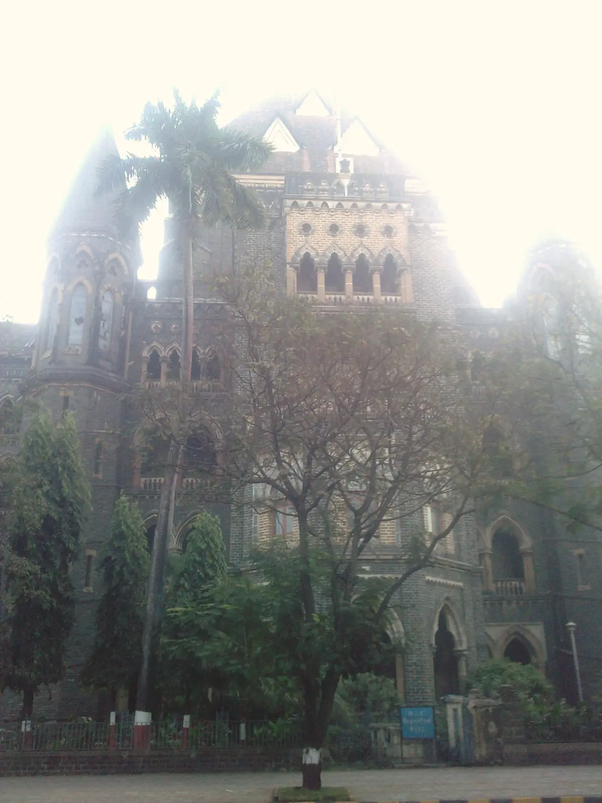 The Bombay High Court building on a misty morning