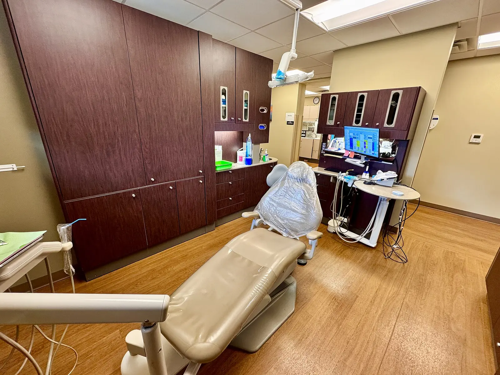 A dental treatment room with a reclining chair